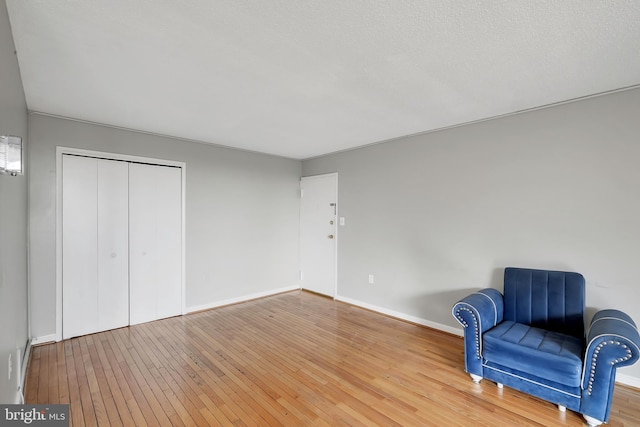 unfurnished room with wood-type flooring