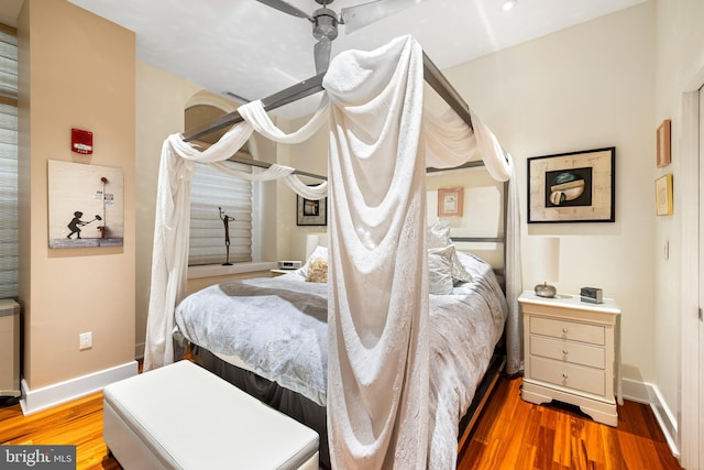 bedroom featuring hardwood / wood-style floors and ceiling fan