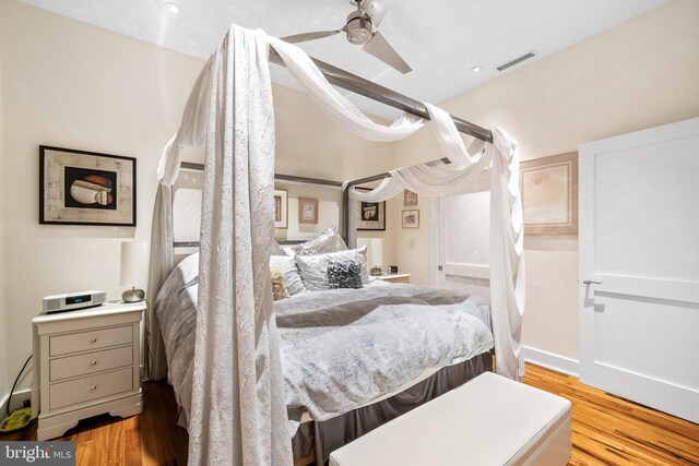 bedroom featuring light wood-type flooring and ceiling fan