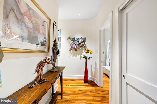 corridor with light wood-type flooring