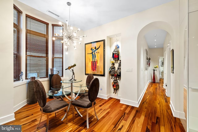 dining area with wood-type flooring