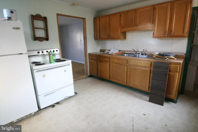 361 Ridgley, Orbisonia, PA 17243 - kitchen with white appliances, light floors, brown cabinets, and a sink