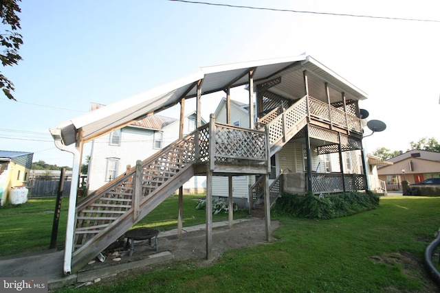 361 Ridgley, Orbisonia, PA 17243 - rear view of property featuring stairway and a lawn