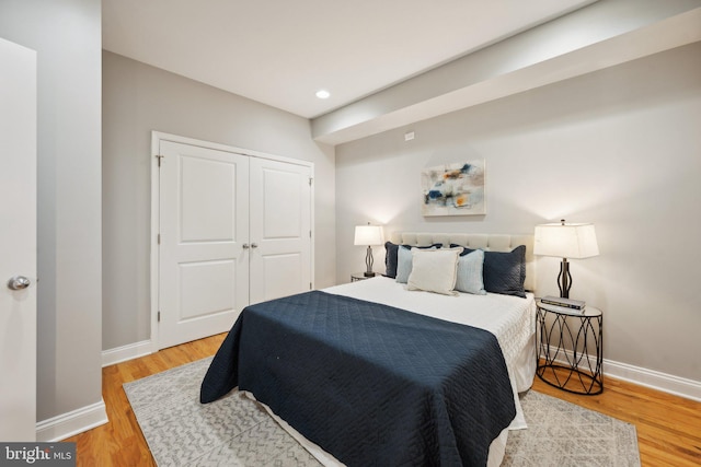 bedroom featuring a closet and wood-type flooring