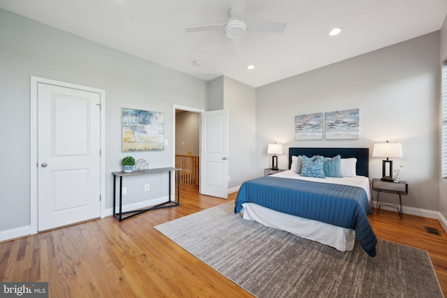 bedroom with light wood-type flooring and ceiling fan