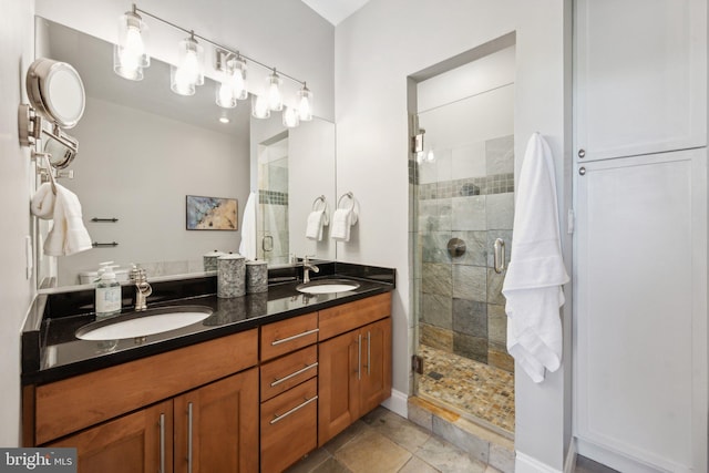 bathroom with vanity, an enclosed shower, and tile patterned floors