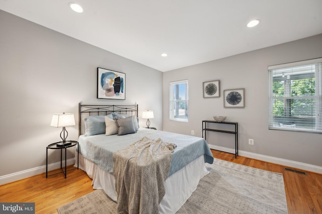 bedroom with hardwood / wood-style floors