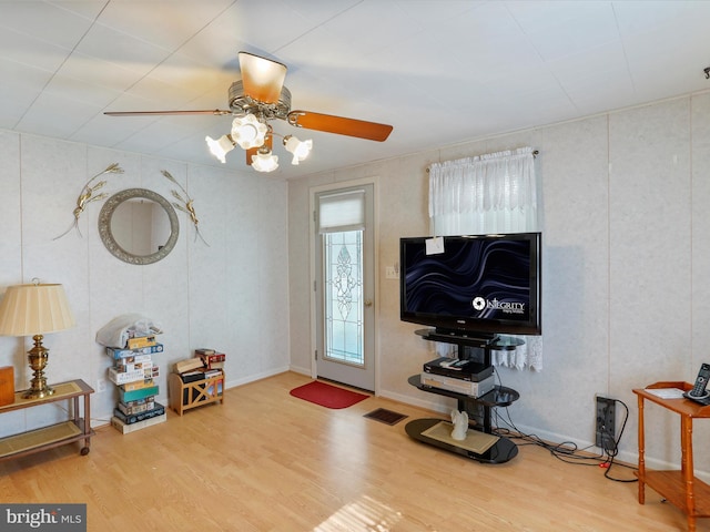 foyer featuring ceiling fan and hardwood / wood-style flooring