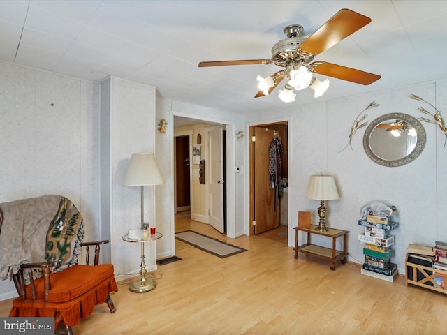 interior space with ceiling fan and light hardwood / wood-style flooring