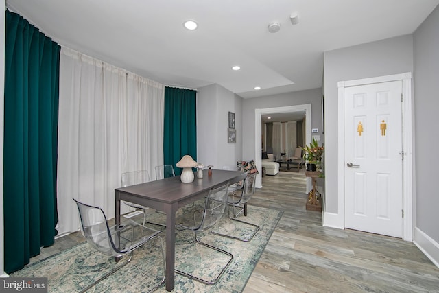 dining area with light hardwood / wood-style flooring