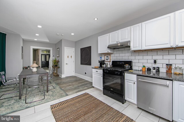 kitchen featuring dishwasher, black range with electric cooktop, white cabinetry, and backsplash