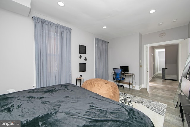 bedroom with light hardwood / wood-style floors