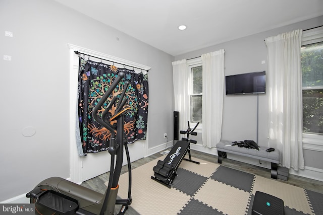 workout area with hardwood / wood-style floors