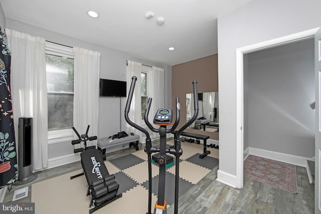 workout room with hardwood / wood-style floors