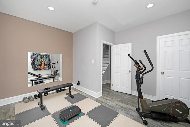 workout room with wood-type flooring