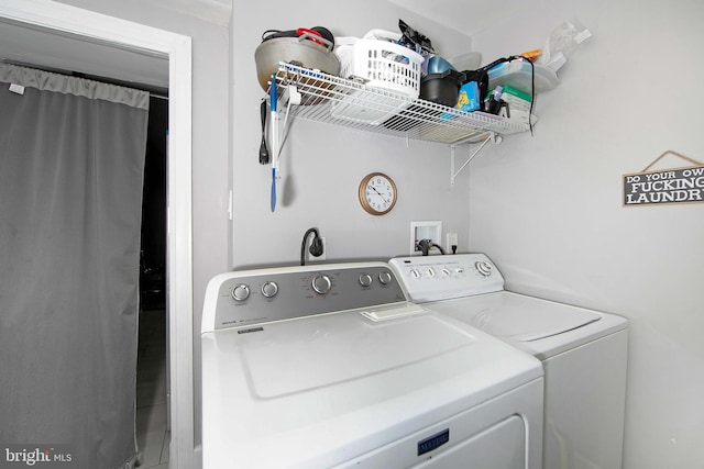 laundry room featuring separate washer and dryer