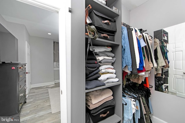 walk in closet featuring light hardwood / wood-style floors