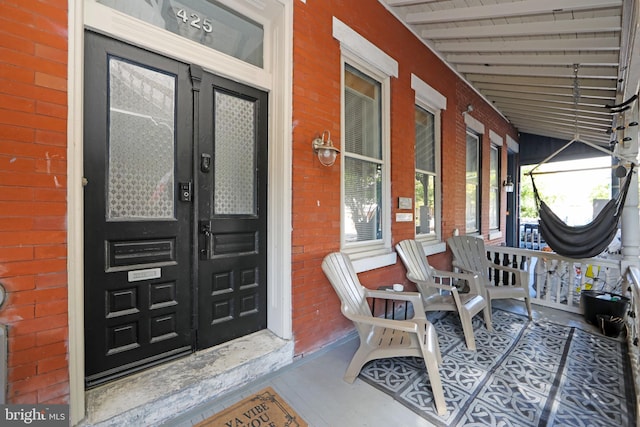 property entrance with covered porch