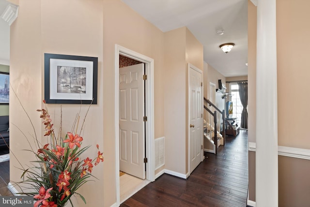 hallway with dark hardwood / wood-style flooring