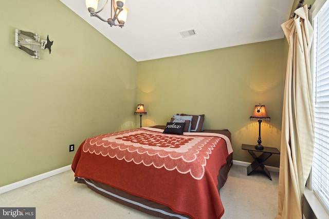 carpeted bedroom with a chandelier, multiple windows, and vaulted ceiling