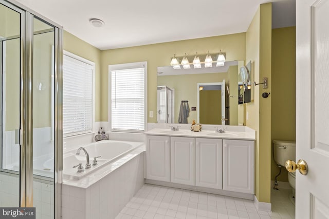 full bathroom with toilet, tile patterned flooring, vanity, and separate shower and tub