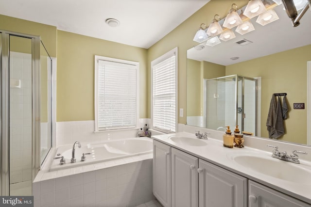 bathroom with vanity and plus walk in shower