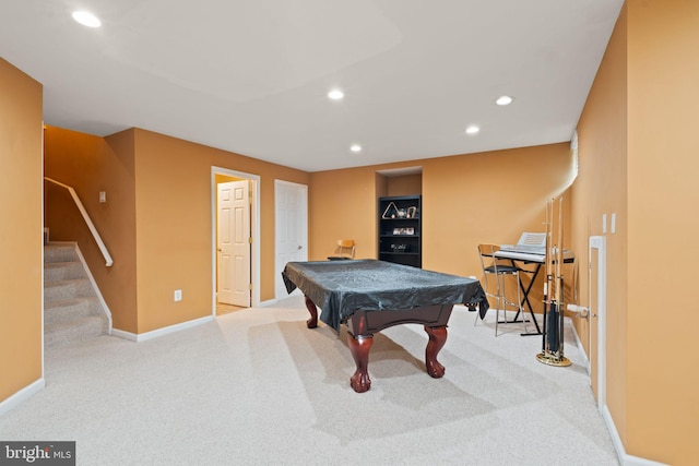 game room with pool table and light colored carpet