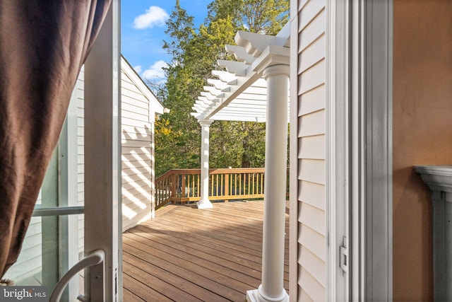 wooden terrace with a pergola