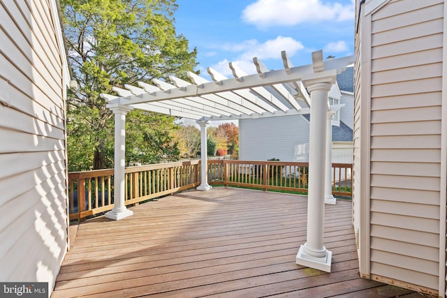 wooden deck featuring a pergola