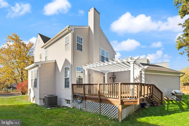 back of property with central AC unit, a lawn, a wooden deck, and a pergola