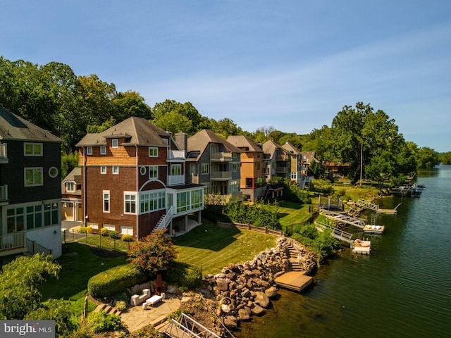 drone / aerial view with a water view