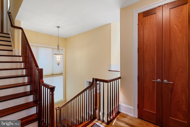 staircase featuring hardwood / wood-style flooring