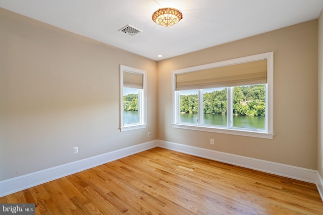 spare room featuring light hardwood / wood-style floors