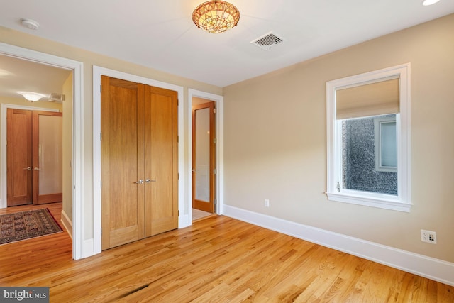 unfurnished bedroom with light hardwood / wood-style flooring