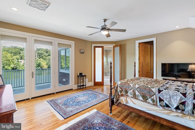 bedroom with light hardwood / wood-style flooring, ceiling fan, and access to outside