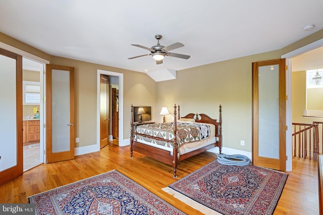 bedroom with light wood-type flooring, ceiling fan, and french doors