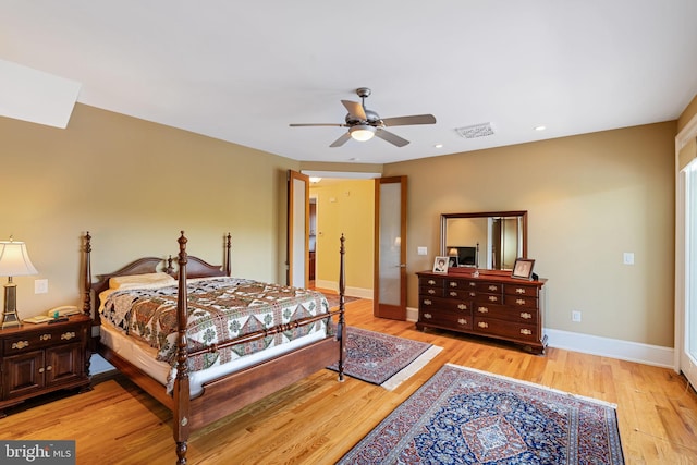 bedroom featuring light hardwood / wood-style flooring and ceiling fan