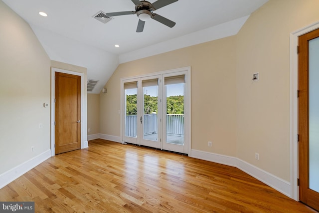 unfurnished bedroom with french doors, light hardwood / wood-style floors, lofted ceiling, access to exterior, and ceiling fan