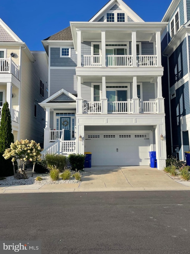 view of front facade with a balcony and a garage