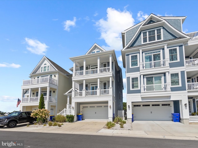 view of front of property featuring a balcony and a garage