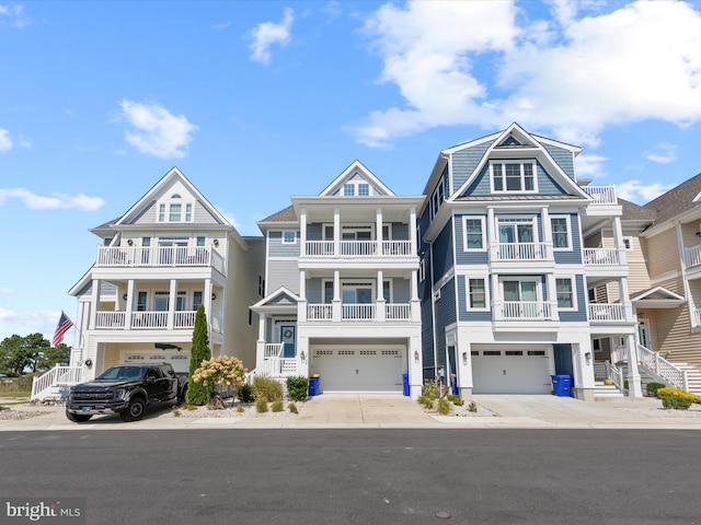 view of front of home featuring a garage and a balcony