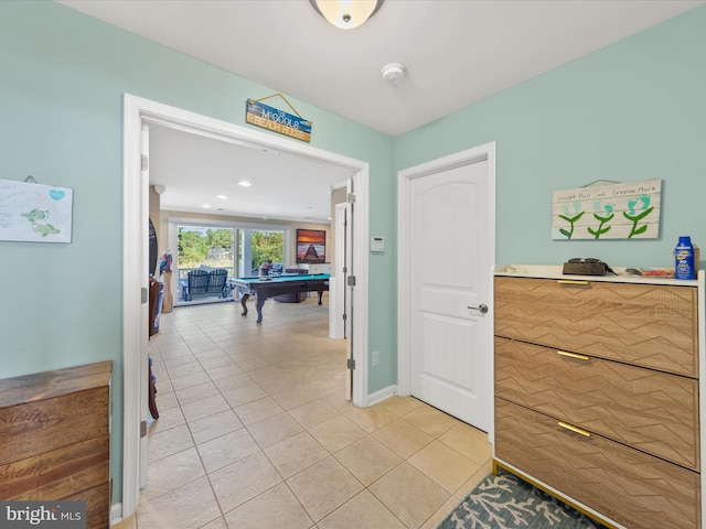 hallway featuring light tile patterned floors