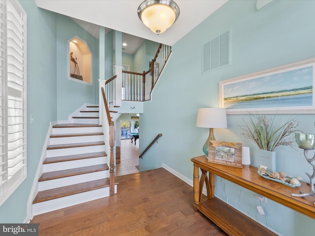 stairway featuring hardwood / wood-style floors