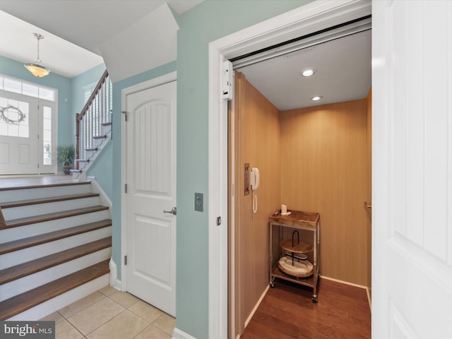 interior space featuring light hardwood / wood-style flooring and elevator