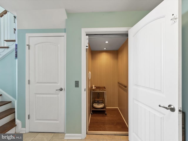 hallway with light tile patterned flooring