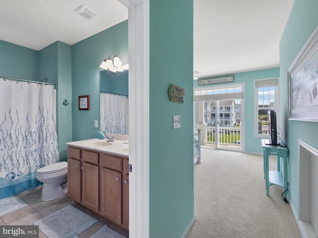 bathroom with a shower with curtain, toilet, and vanity