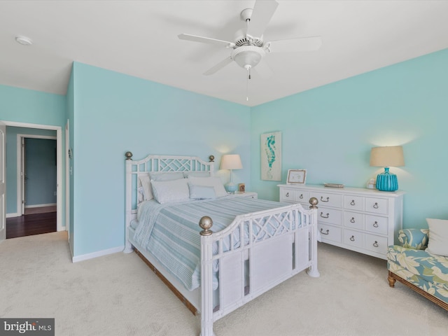 carpeted bedroom with ceiling fan