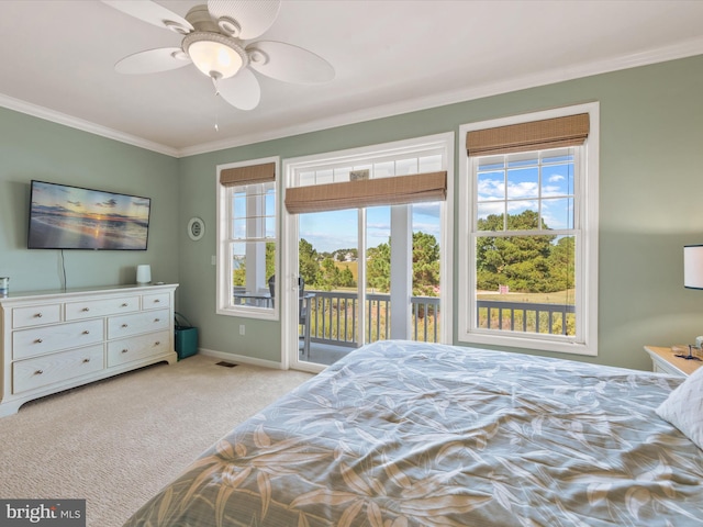 carpeted bedroom with ornamental molding, access to exterior, and ceiling fan