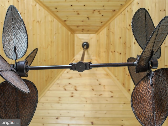 interior space featuring wood ceiling and wooden walls