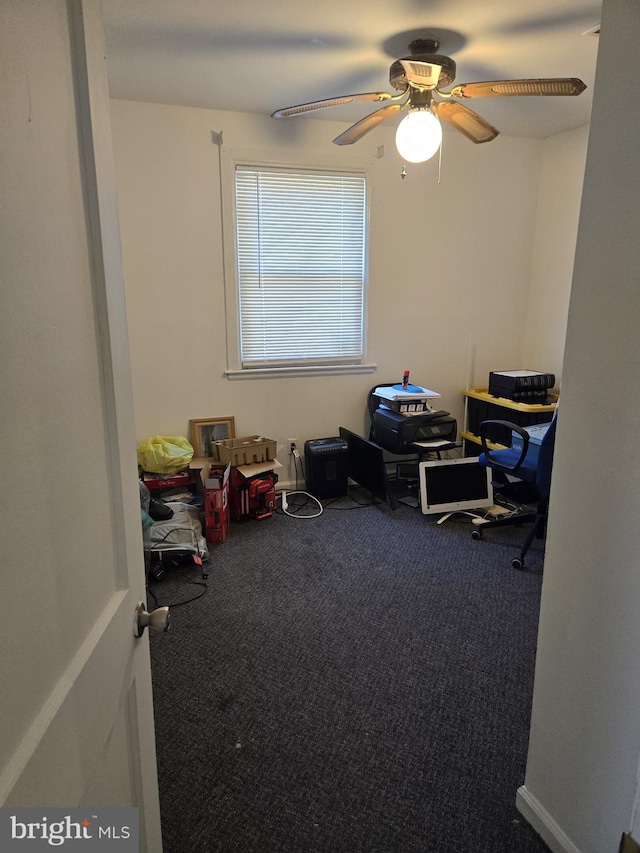 misc room with ceiling fan and carpet flooring